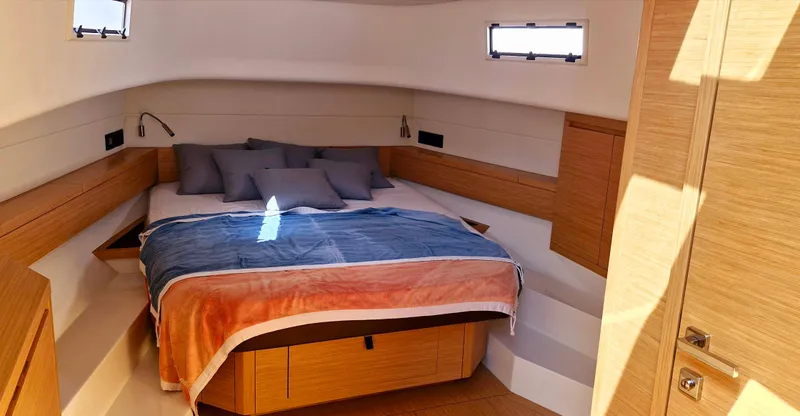  Yacht Photos Pics Luxurious cabin interior of 2020 Pardo Yachts 43 with cozy bed and modern design.