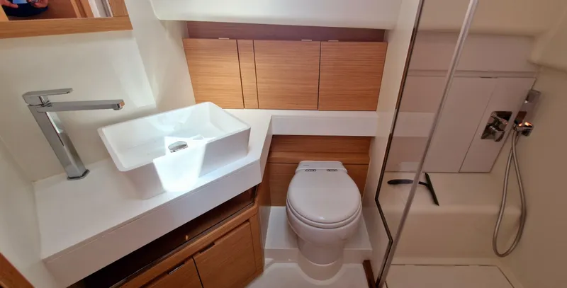  Yacht Photos Pics Modern bathroom in 2020 Pardo Yachts 43, featuring sleek sink, toilet, and shower.