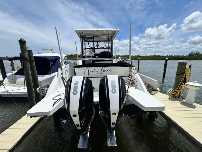  Yacht Photos Pics 2022 Beneteau Flyer 9 SUNdeck docked with dual outboard engines under a clear sky.