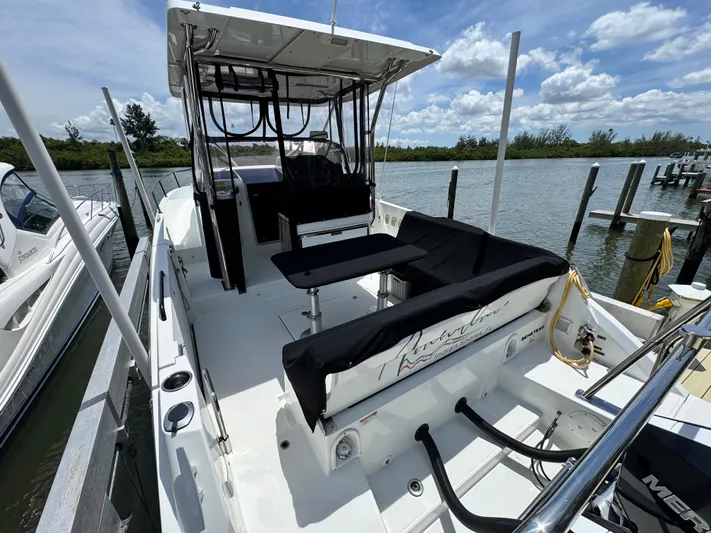  Yacht Photos Pics 2022 Beneteau Flyer 9 SUNdeck boat docked by a scenic waterfront.