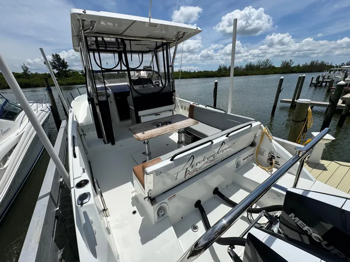  Yacht Photos Pics 2022 Beneteau Flyer 9 SUNdeck docked, showcasing spacious deck and seating area.
