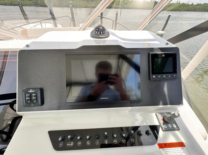  Yacht Photos Pics Control panel of 2022 Beneteau Flyer 9 SUNdeck with Garmin display and various controls.