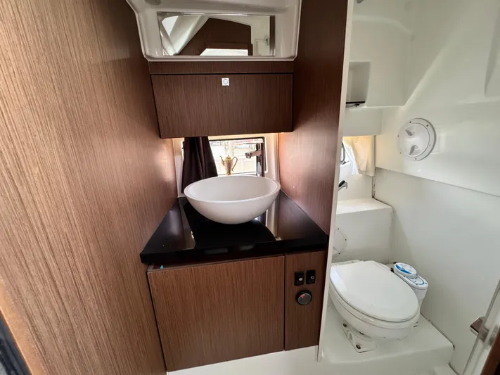 Yacht Photos Pics 2022 Beneteau Flyer 9 SUNdeck bathroom with modern sink and toilet.