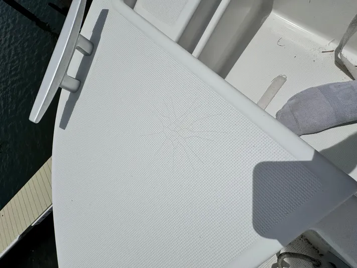  Yacht Photos Pics 2022 Beneteau Flyer 9 SUNdeck boat deck with cleat and textured surface.