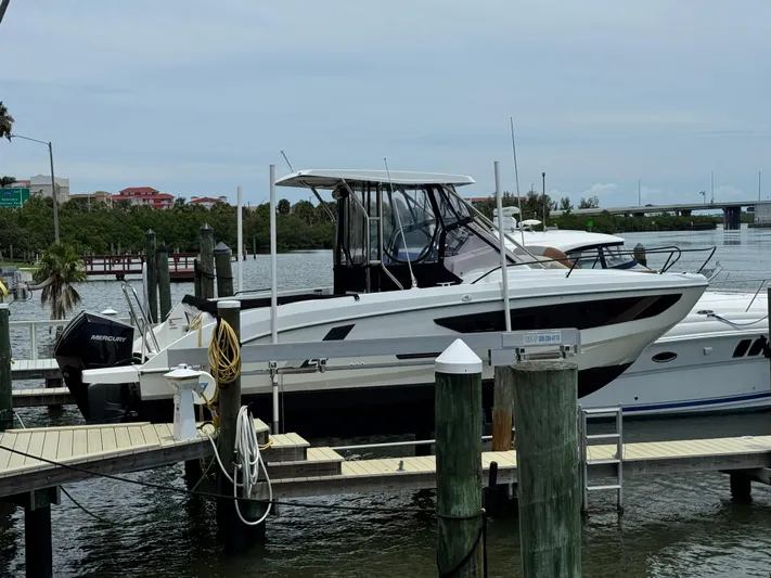  Yacht Photos Pics 2022 Beneteau Flyer 9 SUNdeck docked at marina with Mercury outboard engine.