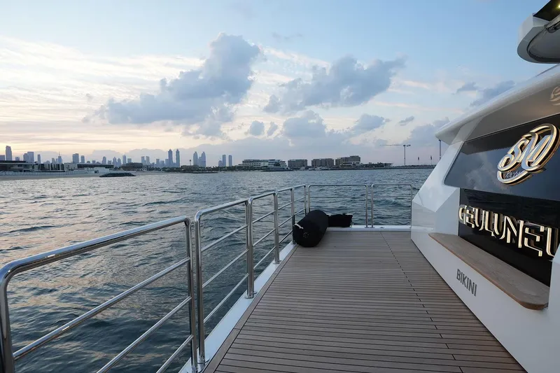 Geulunel Yacht Photos Pics Luxury yacht Majesty 120 cruising near city skyline at sunset, 2025 model.