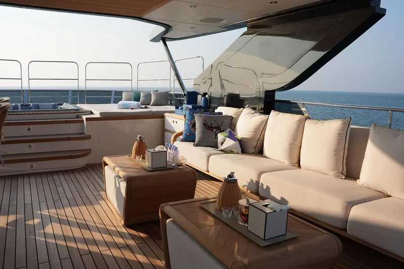 Geulunel Yacht Photos Pics Luxurious deck of 2025 Majesty 120 yacht with elegant seating and ocean view.