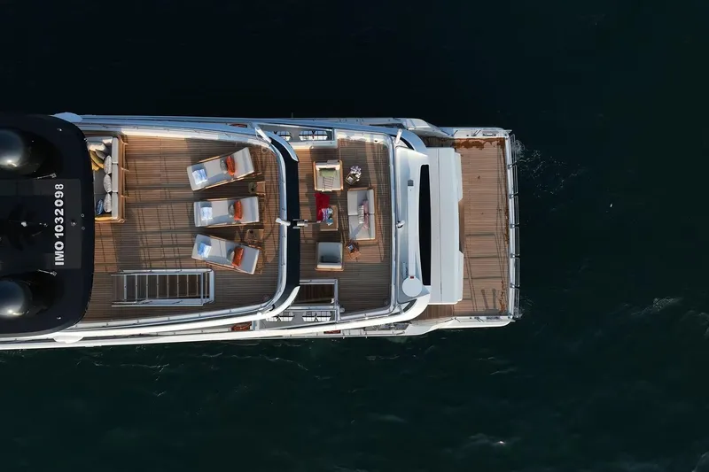 Geulunel Yacht Photos Pics Aerial view of 2025 Majesty 120 yacht deck with seating and sun loungers.