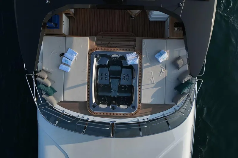 Geulunel Yacht Photos Pics Aerial view of 2025 Majesty 120 yacht deck with jacuzzi and lounge area.
