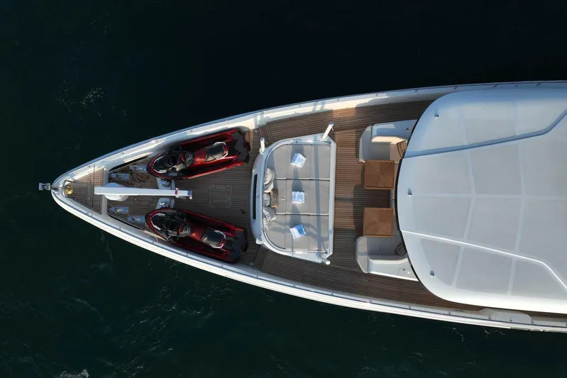Geulunel Yacht Photos Pics Aerial view of 2025 Majesty 120 yacht deck with jet skis and seating area.
