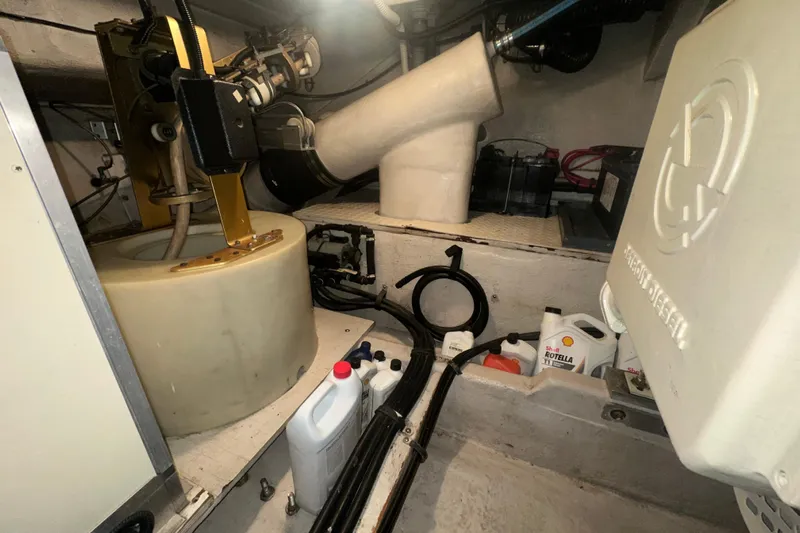  Yacht Photos Pics Engine room of 1998 Sea Ray 500 Sundancer with maintenance supplies and equipment.