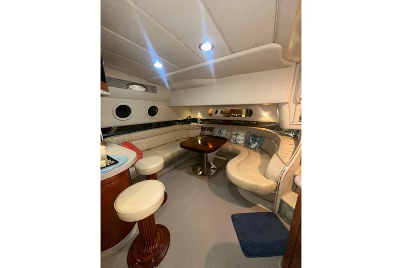  Yacht Photos Pics Luxurious interior of 1998 Sea Ray 500 Sundancer yacht with elegant seating and ambient lighting.
