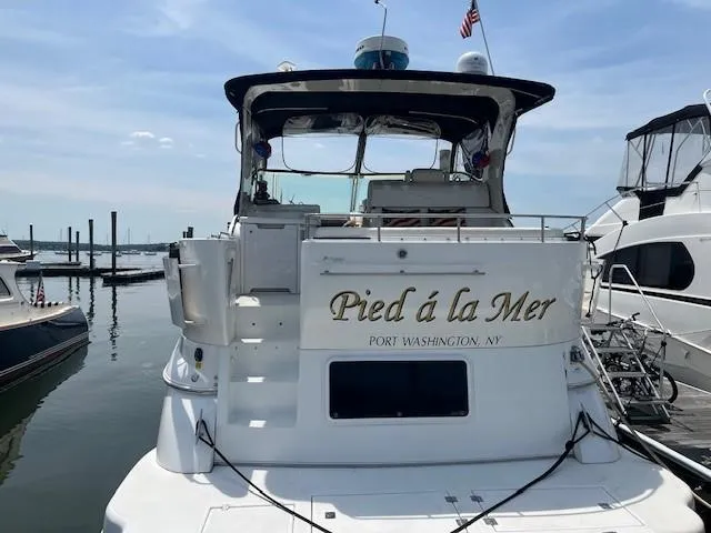  Yacht Photos Pics 2000 Cruisers Yachts 4450 Express Motoryacht docked, named "Pied à la Mer," Port Washington, NY.