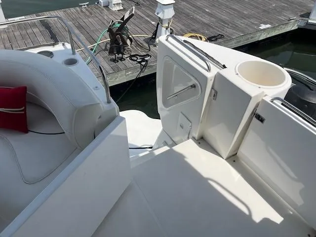  Yacht Photos Pics 2000 Cruisers Yachts 4450 Express Motoryacht docked, featuring white seating and deck area.