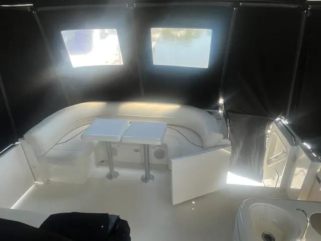  Yacht Photos Pics 2000 Cruisers Yachts 4450 Express Motoryacht interior with seating and tables.