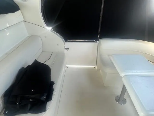  Yacht Photos Pics Interior of 2000 Cruisers Yachts 4450 Express Motoryacht with white seating and table.