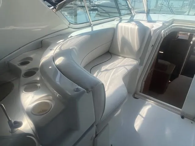  Yacht Photos Pics 2000 Cruisers Yachts 4450 Express Motoryacht interior with white seating and cup holders.