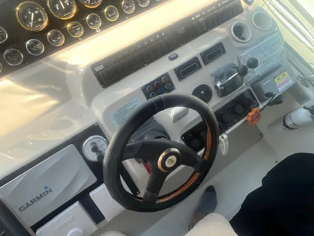  Yacht Photos Pics Helm of 2000 Cruisers Yachts 4450 Express Motoryacht with Garmin navigation system.