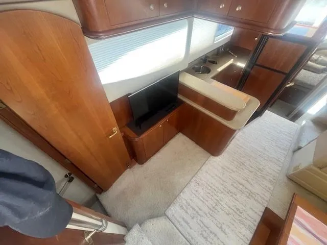  Yacht Photos Pics Interior of 2000 Cruisers Yachts 4450 Express Motoryacht with wood cabinetry and modern amenities.