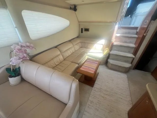  Yacht Photos Pics Luxurious interior of 2000 Cruisers Yachts 4450 Express Motoryacht with beige leather seating.