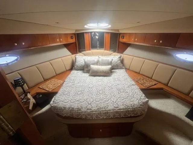 Yacht Photos Pics Luxurious cabin interior of 2000 Cruisers Yachts 4450 Express Motoryacht with elegant bedding.