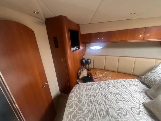  Yacht Photos Pics Luxurious cabin interior of 2000 Cruisers Yachts 4450 Express Motoryacht with elegant bedding.