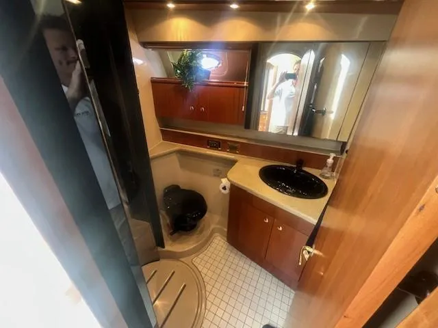  Yacht Photos Pics Luxurious bathroom in 2000 Cruisers Yachts 4450 Express Motoryacht with modern amenities.