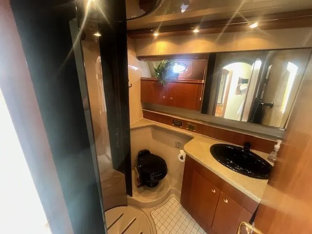  Yacht Photos Pics Luxurious bathroom in 2000 Cruisers Yachts 4450 Express Motoryacht with modern fixtures.