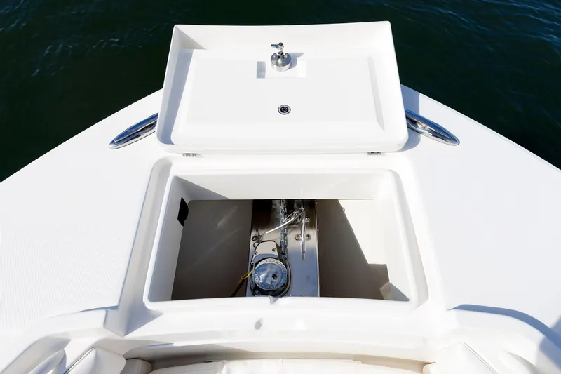 34 Ss Yacht Photos Pics 2018 Regulator 34SS boat anchor compartment with open hatch, showing storage and hardware.