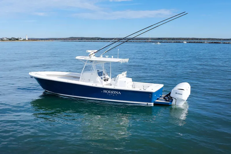 34 Ss Yacht Photos Pics 2018 Regulator 34SS boat on calm water with clear blue sky.