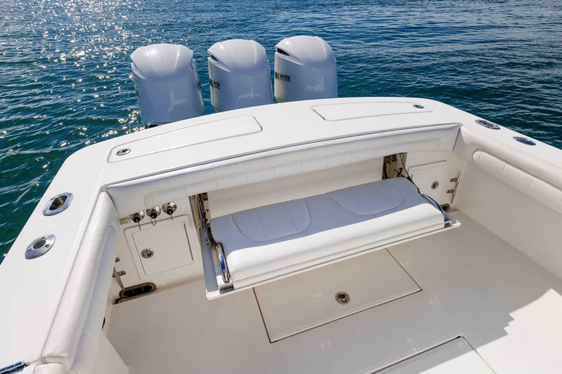 34 Ss Yacht Photos Pics 2018 Regulator 34SS boat with triple engines, spacious deck, and seating on water.