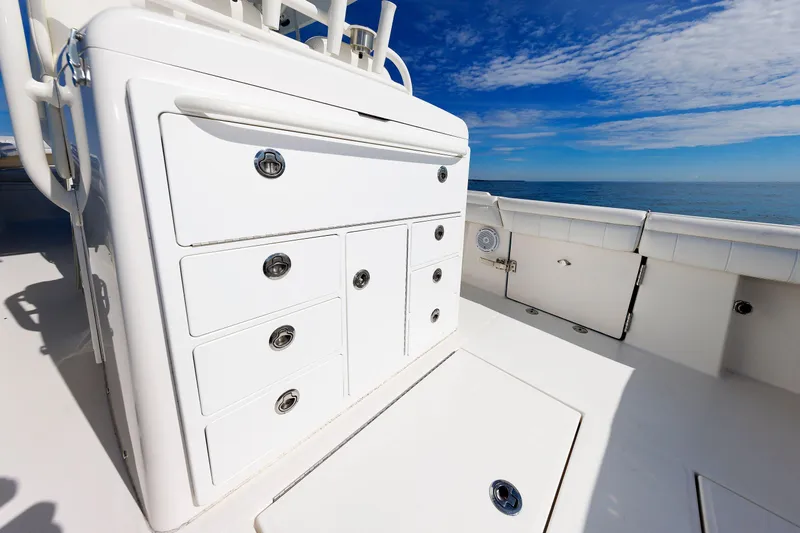 34 Ss Yacht Photos Pics 2018 Regulator 34SS boat interior with storage compartments, ocean view, and clear sky.
