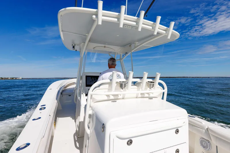 34 Ss Yacht Photos Pics 2018 Regulator 34SS boat cruising on open water under clear blue sky.