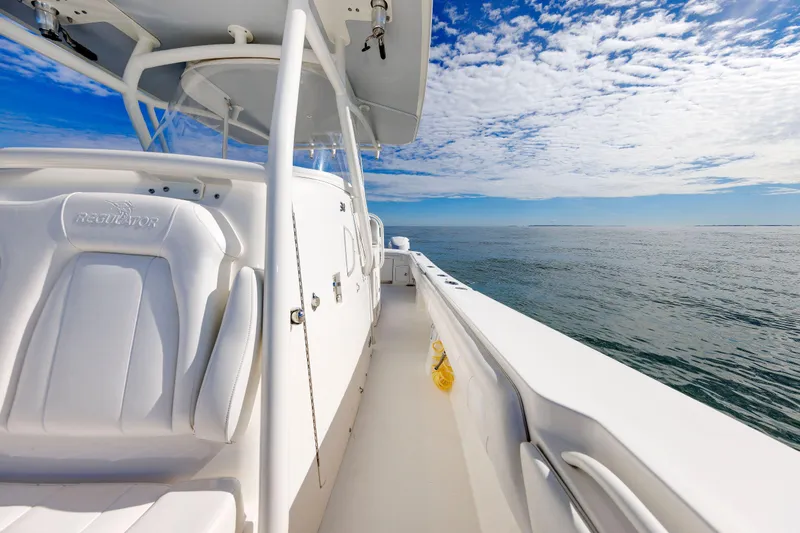 34 Ss Yacht Photos Pics 2018 Regulator 34SS boat on open water under a blue sky with clouds.