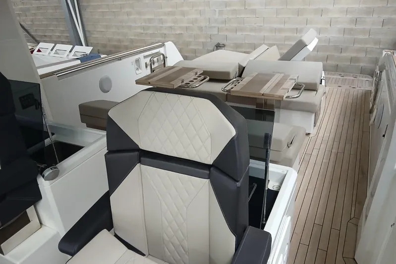 Fjord 41 Xl Yacht Photos Pics Luxurious interior of 2021 Fjord 41 XL yacht with elegant seating and wooden flooring.