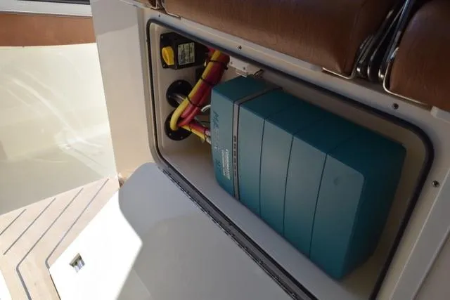 Way Out Yacht Photos Pics 2023 Scout 377 LXF electrical compartment with wiring and battery system.