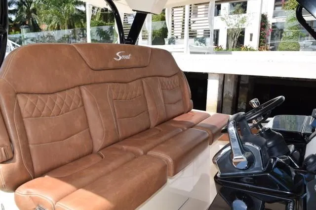 Way Out Yacht Photos Pics 2023 Scout 377 LXF boat with luxurious brown leather seating and modern helm.