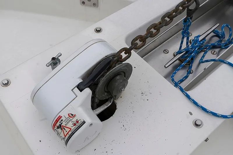 Sunshine Yacht Photos Pics Anchor windlass on 1986 Marine Trader Tradewinds 47 boat deck with chain and rope.