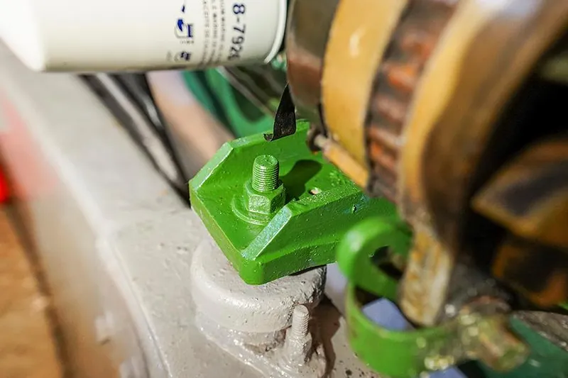 Sunshine Yacht Photos Pics Close-up of a 1986 Marine Trader Tradewinds 47 engine component with green mounting bracket.