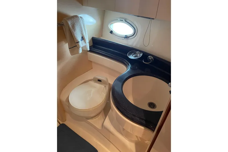 Offshore Flyer Yacht Photos Pics Bathroom interior of 2000 Azimut 46 Flybridge MY yacht, featuring sink and toilet.