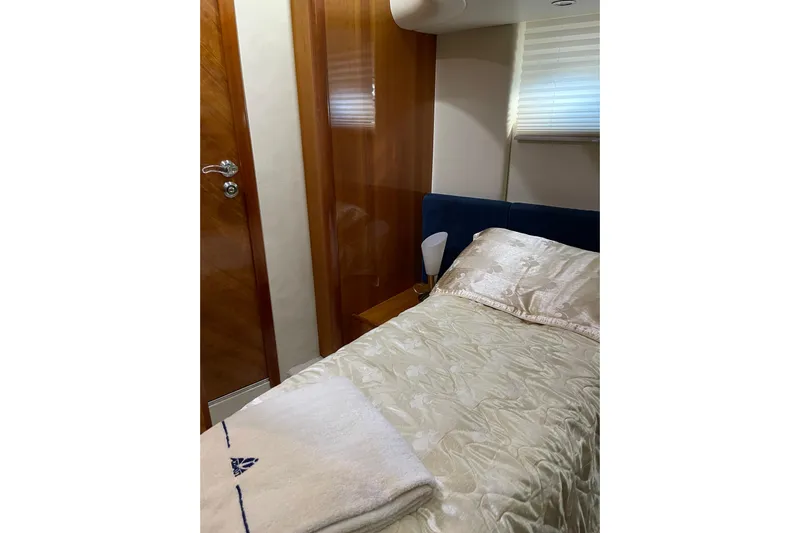 Offshore Flyer Yacht Photos Pics Luxurious cabin interior of 2000 Azimut 46 Flybridge MY yacht with elegant bedding.