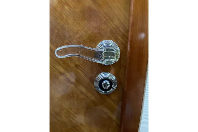 Offshore Flyer Yacht Photos Pics Chrome door handle and lock on Azimut 46 Flybridge MY, 2000 model yacht.