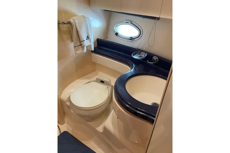 Offshore Flyer Yacht Photos Pics Bathroom interior of 2000 Azimut 46 Flybridge MY yacht, featuring toilet and sink.