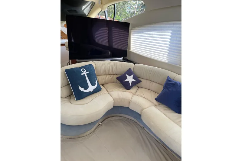 Offshore Flyer Yacht Photos Pics Luxurious interior of 2000 Azimut 46 Flybridge yacht with nautical-themed cushions.