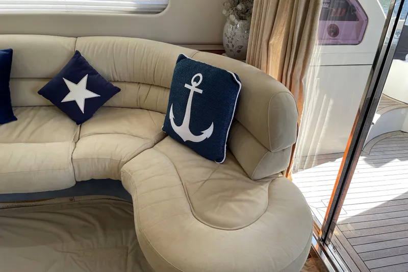 Offshore Flyer Yacht Photos Pics Luxurious Azimut 46 Flybridge MY 2000 yacht interior with nautical-themed cushions.