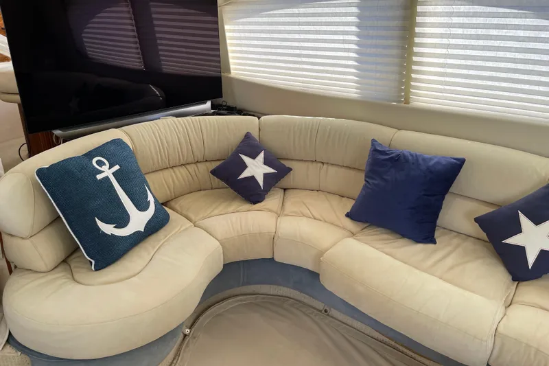 Offshore Flyer Yacht Photos Pics Luxurious Azimut 46 Flybridge MY 2000 yacht interior with nautical-themed cushions.
