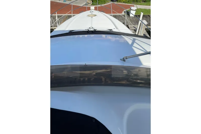 Offshore Flyer Yacht Photos Pics Azimut 46 Flybridge MY 2000 yacht deck view, showcasing sleek design and railing.