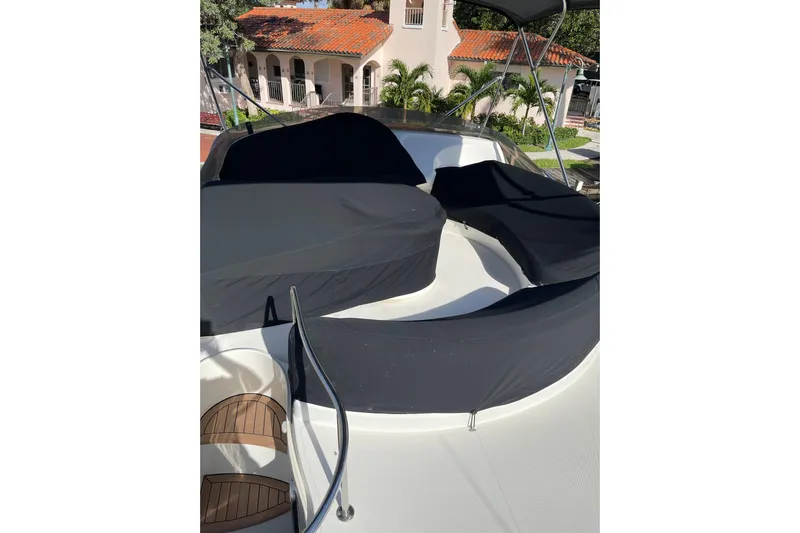 Offshore Flyer Yacht Photos Pics Azimut 46 Flybridge MY 2000 yacht with covered seating area on deck.