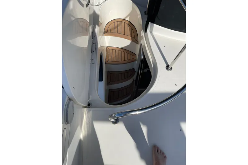 Offshore Flyer Yacht Photos Pics Staircase on 2000 Azimut 46 Flybridge MY yacht with wooden steps and railing.