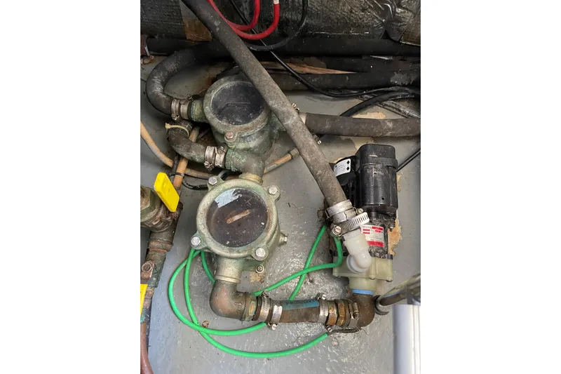 Offshore Flyer Yacht Photos Pics Engine room components of a 2000 Azimut 46 Flybridge MY yacht, featuring hoses and valves.